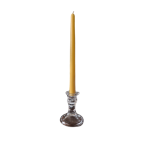 A 25cm beeswax taper candle in a glass candle holder