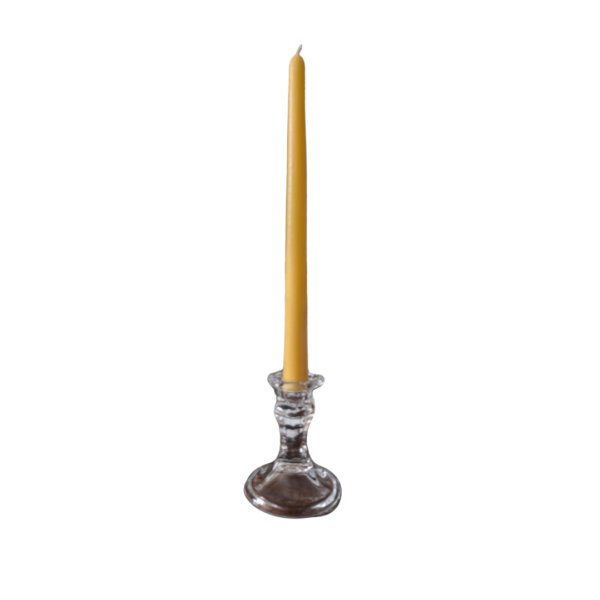 A 25cm beeswax taper candle in a glass candle holder