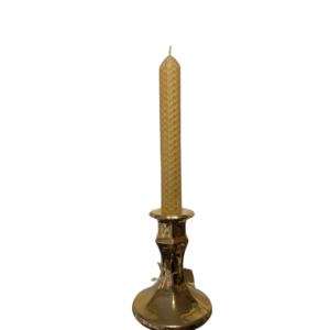 A 17cm rolled beeswax taper candle in a glass candle holder
