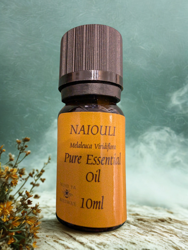 NAIOULI WITH BACKGROUND NAIOULI essential oil with some herbs and steam in the background.